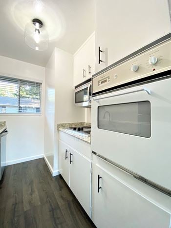 Kitchen with Oven and Hardwood Floors at 2120 Valerga in Belmont, 94002